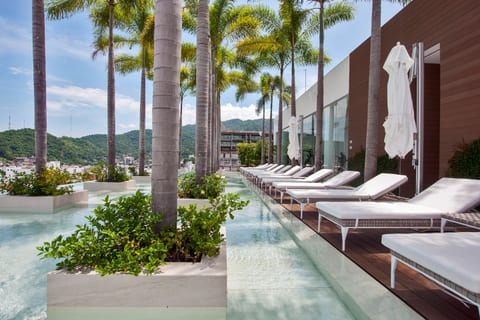 Rooftop w/ chaise lounges to relax and unwind.