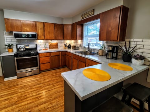 Enjoy an open-designed kitchen and dining area with two additional seats at the breakfast counter.