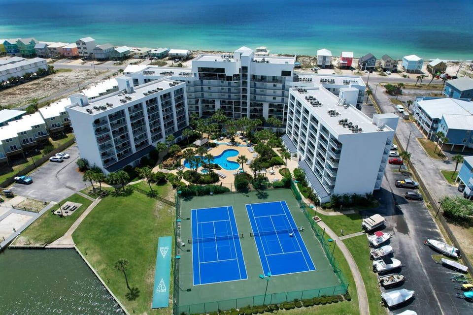 Resort-style amenities without resort fees. We offer a clean, beautiful pool and hot tub, as well as pickle ball courts, shuffle board and two fishing piers. As if that's not enough, as you can see, the gulf is right there across the street. IKR!