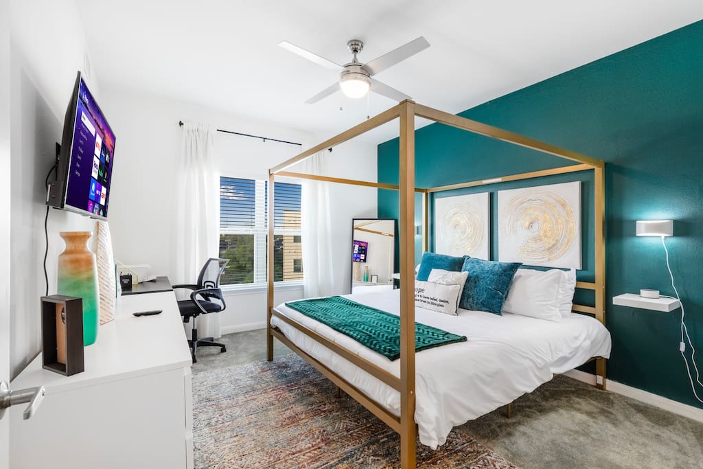 Unwind in this beautiful King size bed at the end of a long day.  Work from this location using the dedicated workspace equipped with a printer and phone charging station.  43-inch Smart TV.