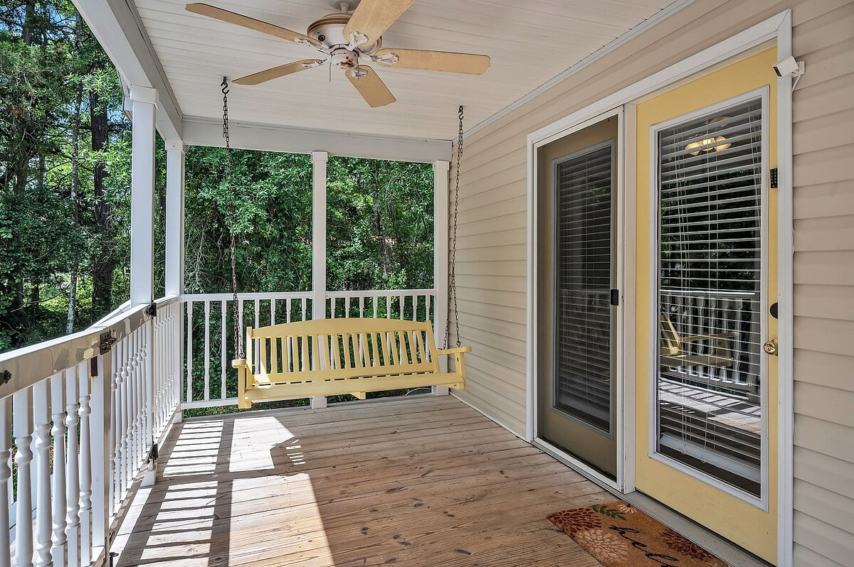 The porch swings and ceiling fans make the outdoor space a great place to relax and unwind.