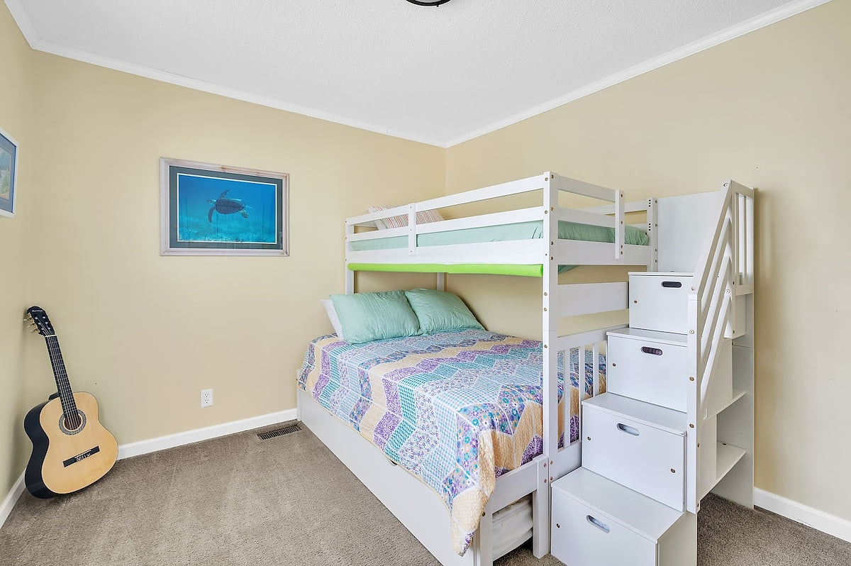 The Bunkbed Room contains a twin bed on top and a full size below.  And a twin size trundle bed (not shown) pulls out from underneath. The steps are drawers that can be used like a dresser.