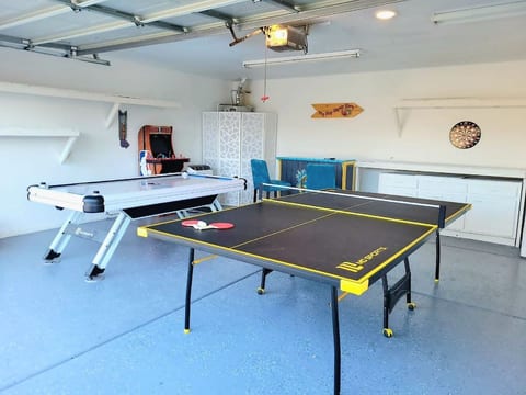 Game room! We offer air hockey, ping pong, an NBA basketball video game, a Paw Patrol video game, darts, and a Roku TV to complete the room!
