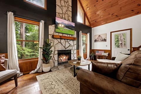 Modern comfort meets timeless warmth in our cozy living room. Curl up by the fireplace, with a stack of firewood nearby, and let the ambiance wrap you in its embrace.