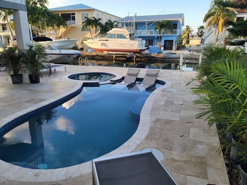Resort style inground pool and hot tub.