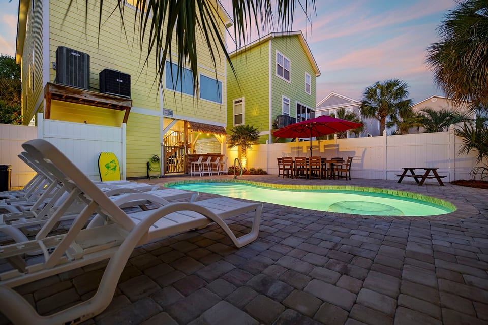 Slip into the heated saltwater pool while the sun drops behind the palms — this is what you came for, and it's waiting the moment you arrive.