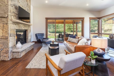 Open and light: the living area is a place to enjoy family and friends. Gather around the fire, watch a game or just hang out playing games or doing a puzzle.