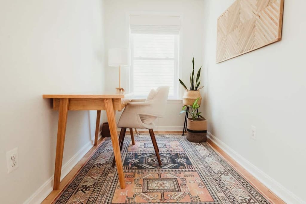 Find a cozy, quiet nook upstairs to remote work! This is part of the upstairs queen bedroom. 