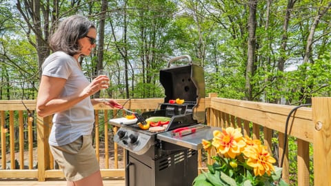 Grill your favorites overlooking the canopy of trees