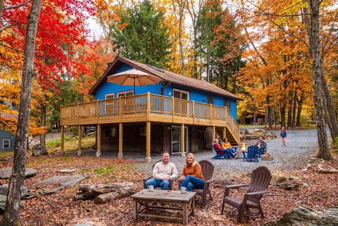 Guests enjoying coffee, looking toward the lake in the Autumn.