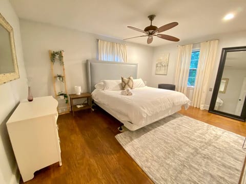 Primary room with king bed, private bath, and tv.