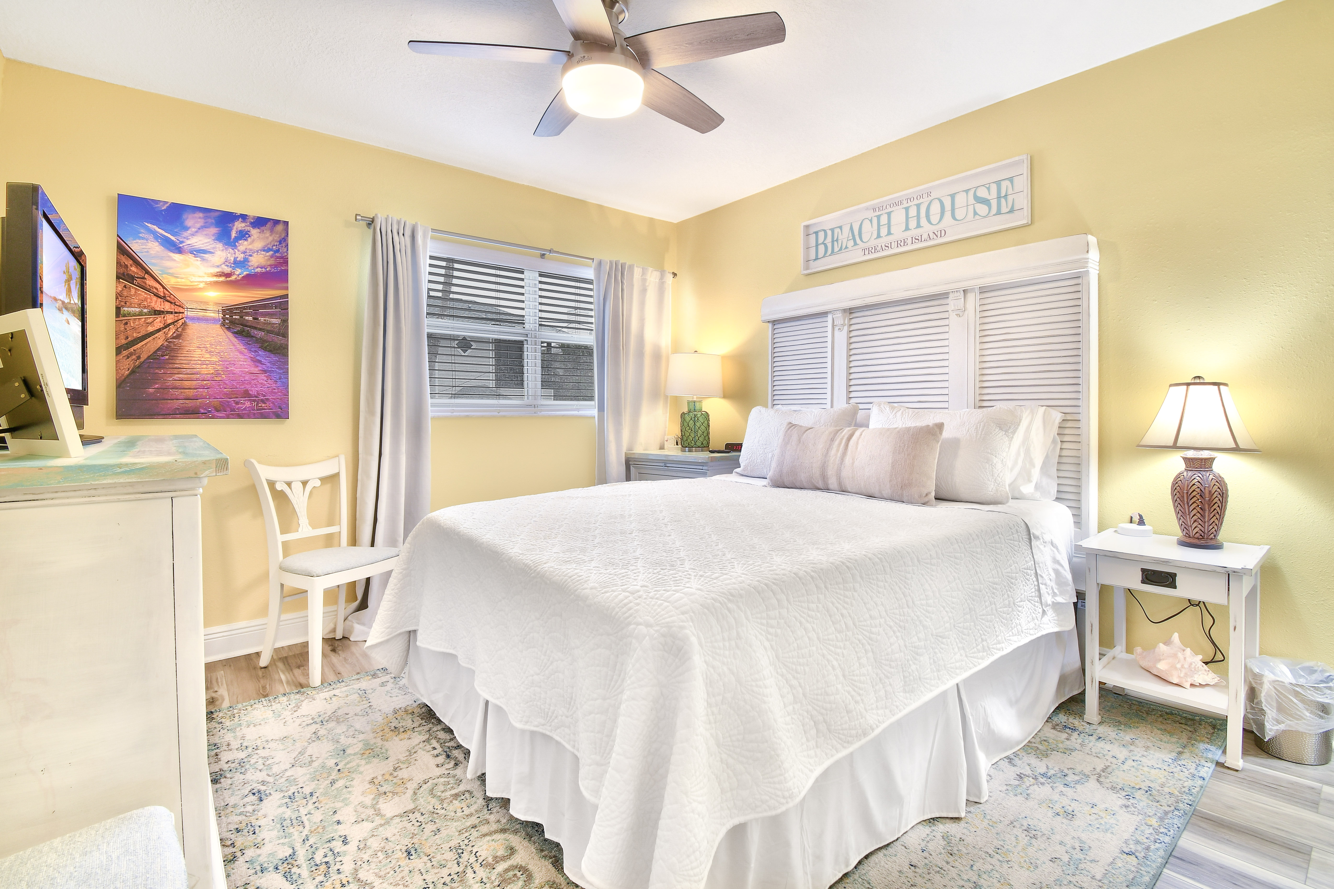 A comfortable bed to relax in every night with black out curtains. Funshine Sunset Beach - Steps from the beach!!