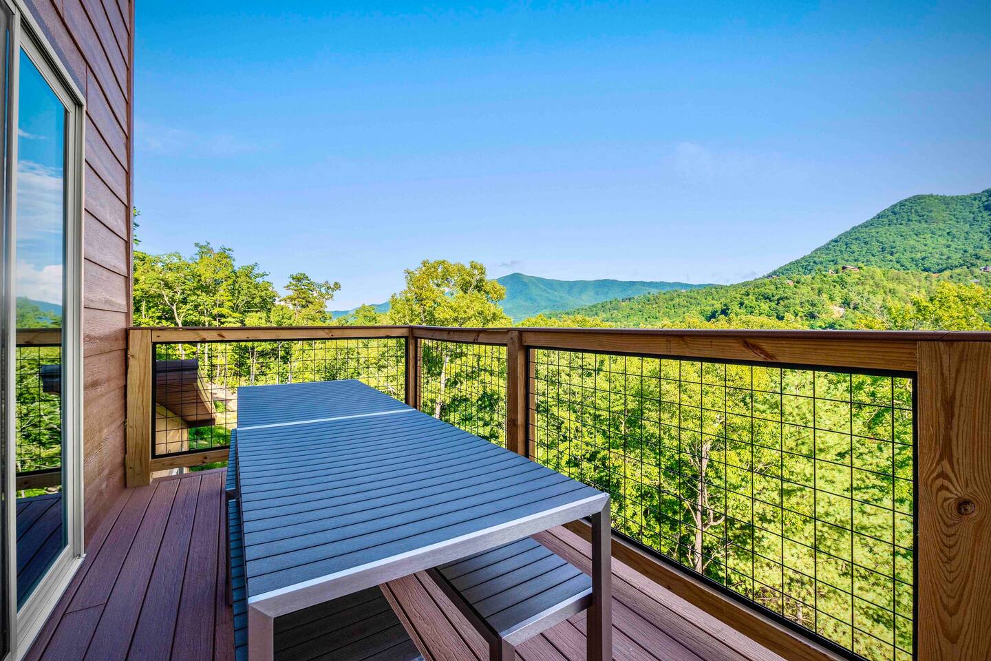 Dining table and bench chairs for your group to enjoy an outdoor meal. - The Dancing Firefly - Sevierville