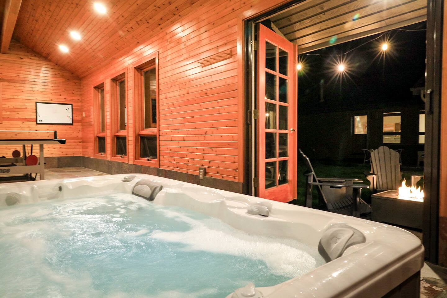 Indoor Hot Tub that opens to the spacious private backyard. Yes Ping pong as well!  The Sunriver Cascade House