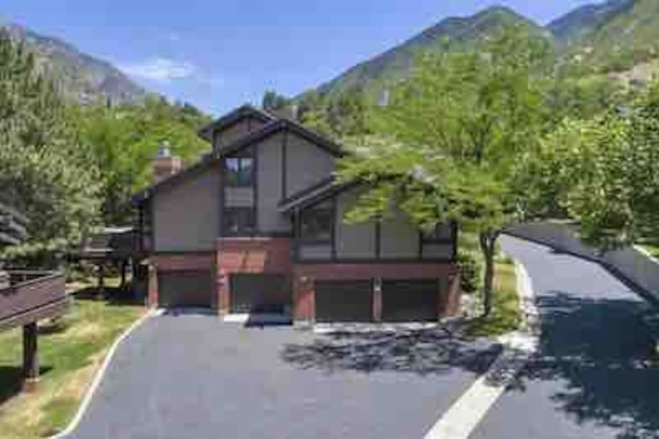 Private, secluded hot tub on deck to the left
2 car garages with easy access to get in and out on the right. The opening to Big Cottonwood Canyon (BCC) is just behind the building in the center~Summer