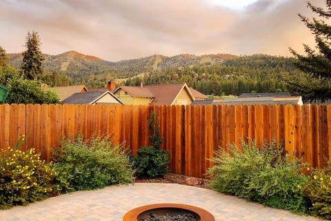 Fully fenced back patio with gas fire-pit and ski slope views of Bear Mountain.