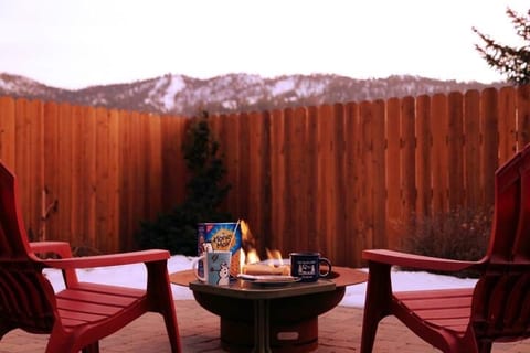 Fully fenced back patio with gas fire-pit and ski slope views of Bear Mountain.