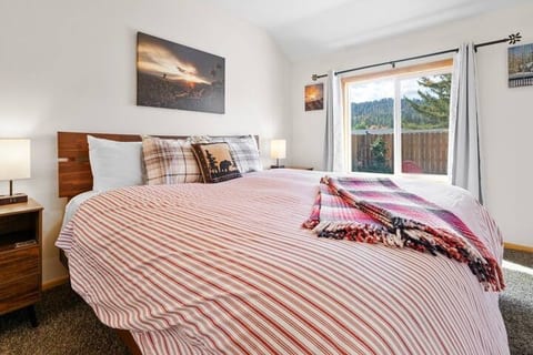Master bedroom with King size bed, ceiling fan, large closet, and scenic views