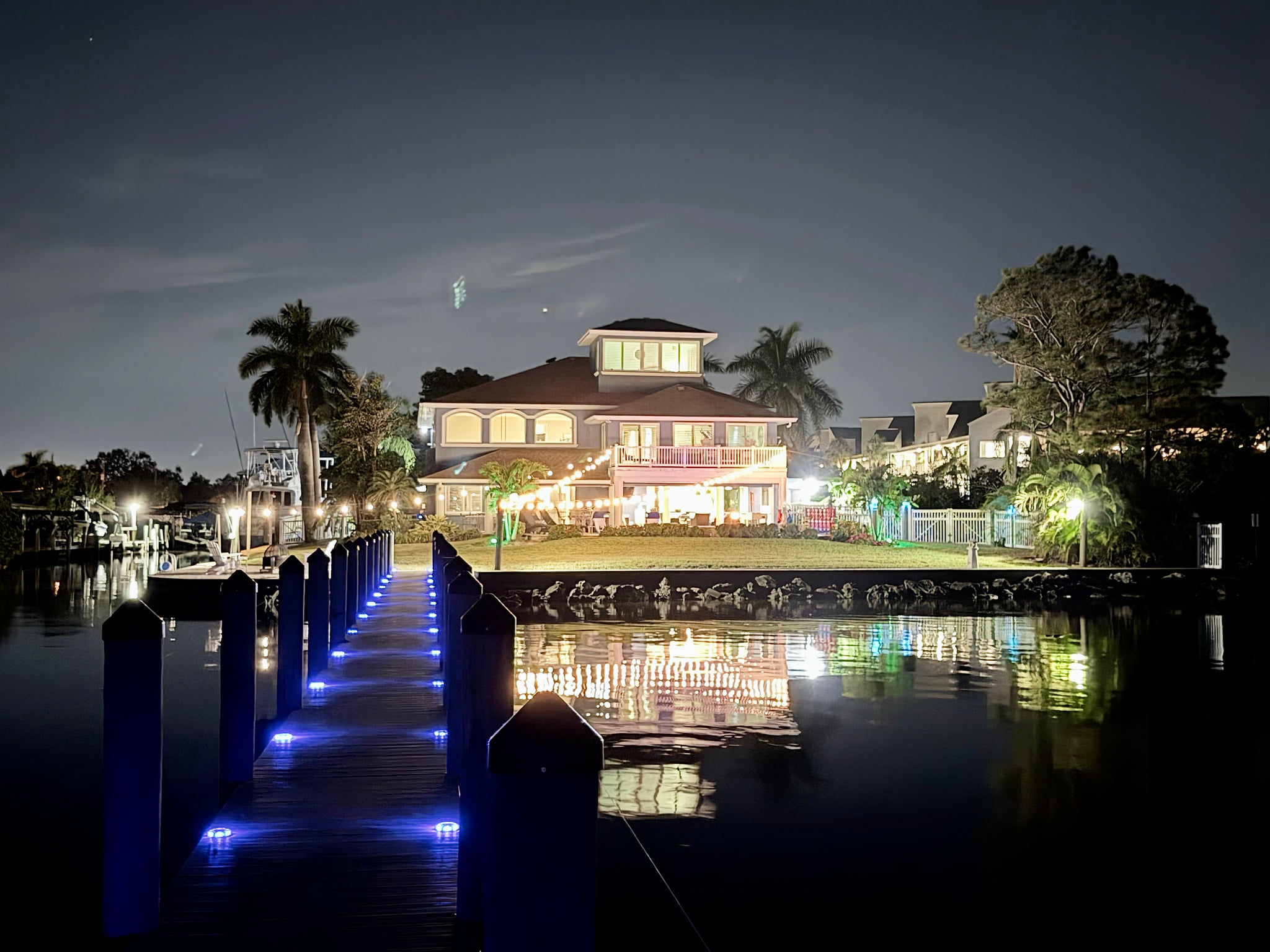 The house all lite up at night. Very peaceful
