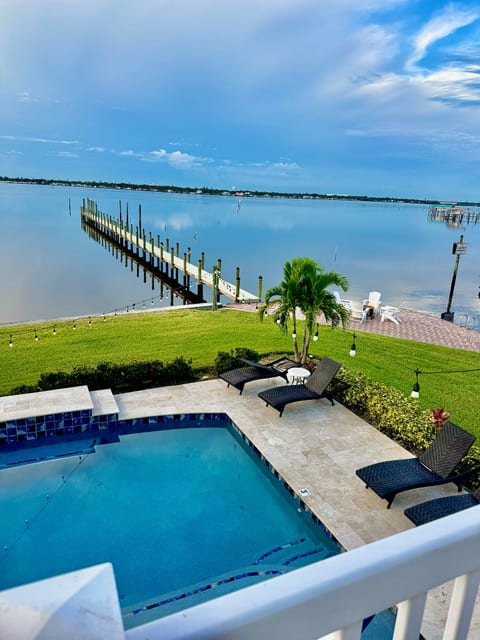 Riverfront 4BR: Heated Pool, Hot Tub, Boat Dock