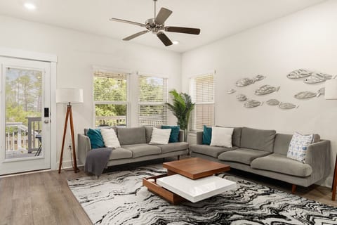 Bright and inviting living room with comfortable seating—perfect for relaxing after a day of exploring.