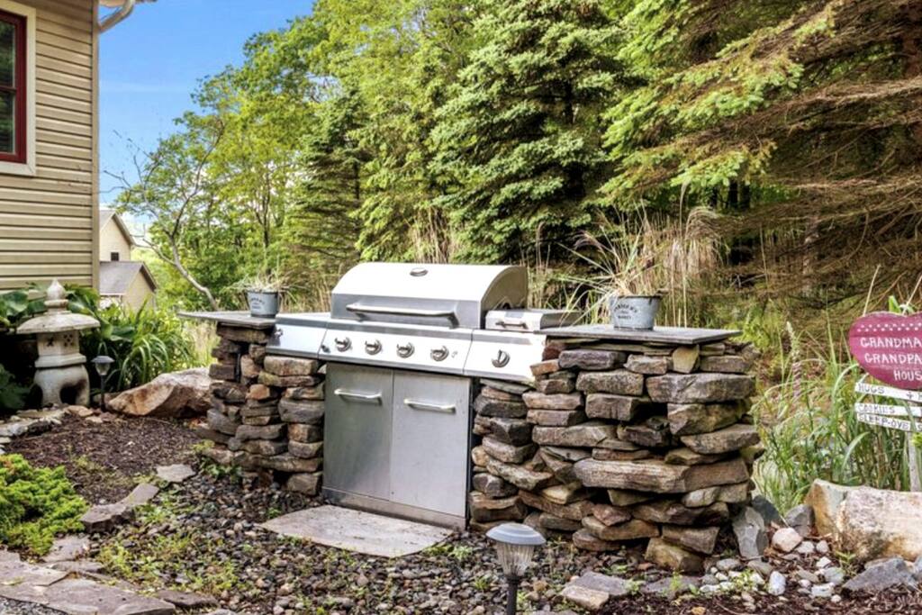 Take your culinary skills outside and cook up a storm on the gas grill located in the backyard, with the added convenience of a provided propane line! - Hideaway Between Lakes - Lake Harmony