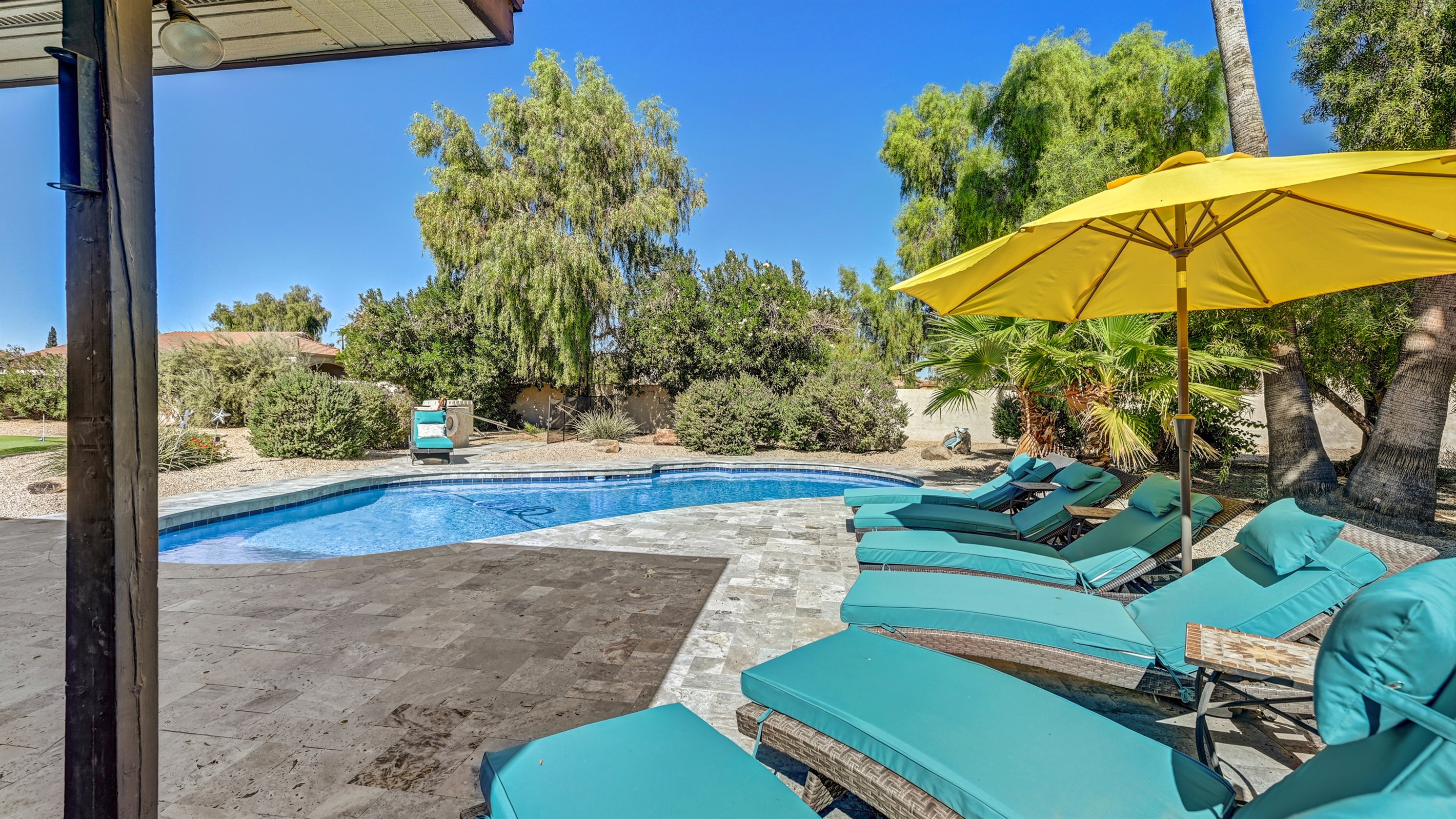 Relax and listen to the wind blowing throw the Palm Trees Private Paradise Heated Pool Game Room Putting