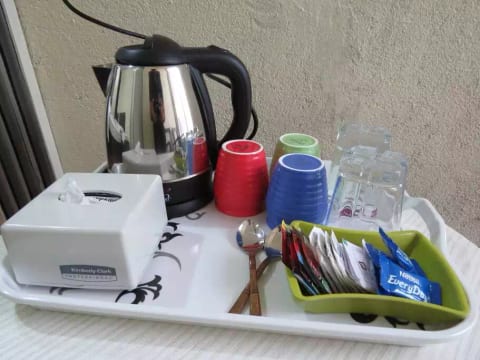 Tea & coffee kettle along with a bottle of mineral water with compliments from the host.