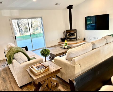 Living room with wood burning fireplace.