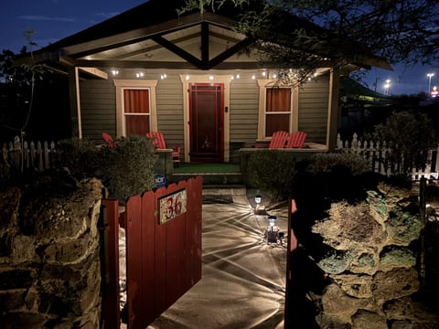 Evening arrival: the porch lights are on and the gate is open