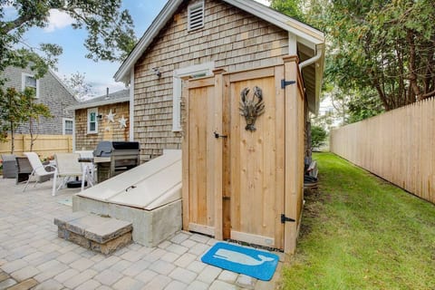 Enclosed outdoor shower with hot/cold water.