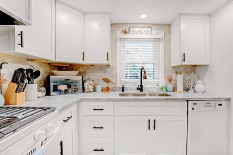 Kitchen has been completely redone and is fully stocked. Granite countertops, gas stove/oven, brisker, toaster oven, coffee maker, Keurig, french press, coffee bean grinder, grilling tools, pots/pans, basic spices, non-stick spray, etc.