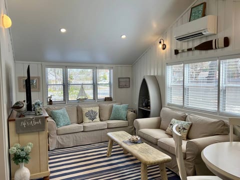 Coastal Cape Cod Cottage Charm. Unwind after a long day at the beach and sightseeing - comfortable seating and smart TV.