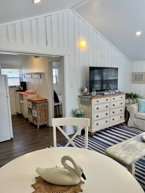 Dining for 4 both inside and out (picnic table with umbrella) with cooking supplies for making meals on the stove, in the oven or on the grill!