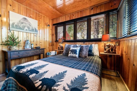 The "Lazy Bear" bedroom is located downstairs on the main living area and has a queen sized bed, full length mirror, extra blankets, lots of pillows and heating.