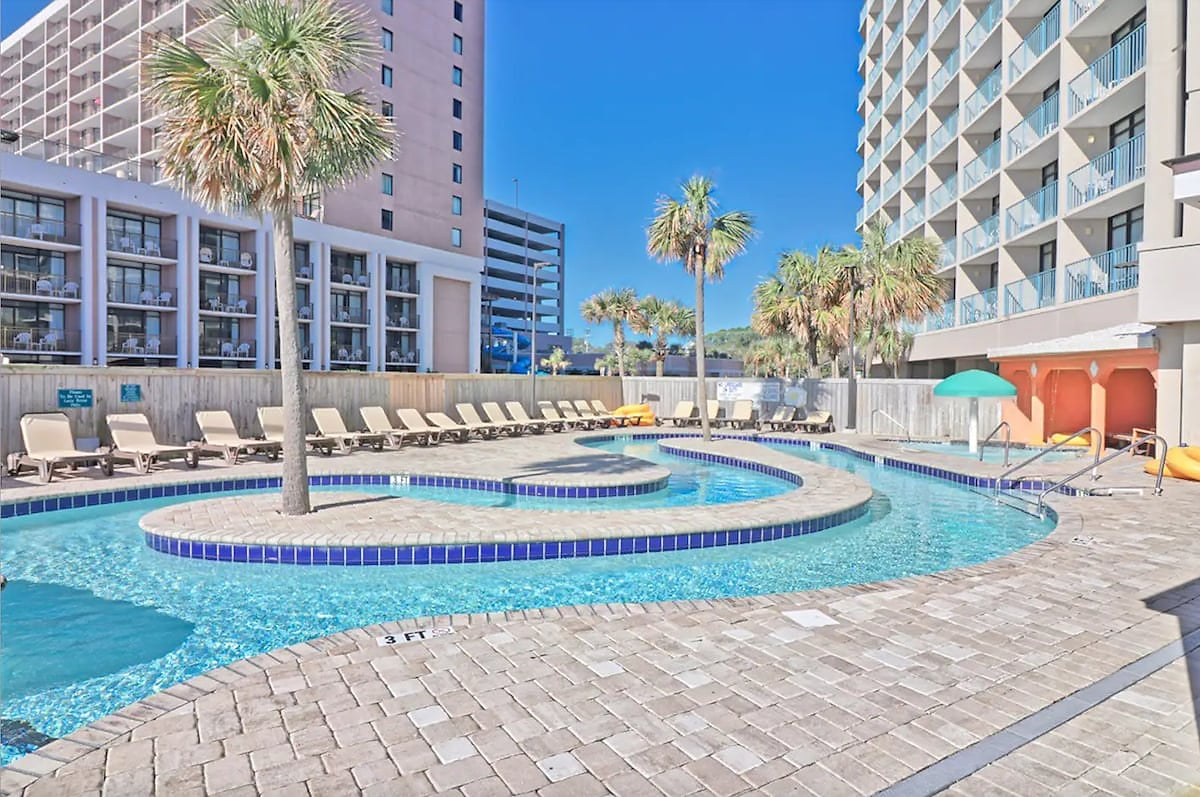 Oceanfront fresh water pool, lazy river and sun deck with lawn area provide the relaxing atmosphere to complement your vacation.