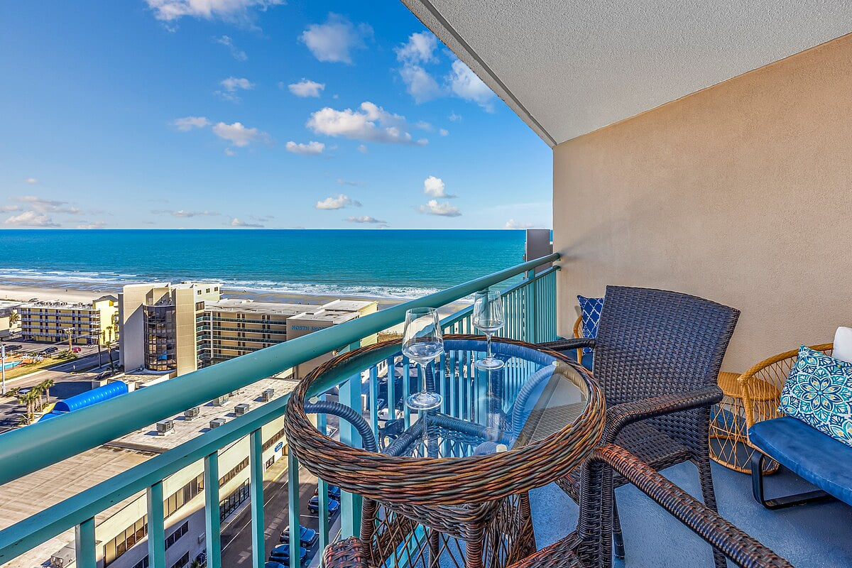 Living room with direct oceanfront views 1602 Sand Dunes Ocean Overlook