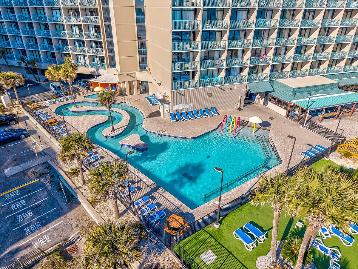 Outdoor pool area is steps from the ocean.
