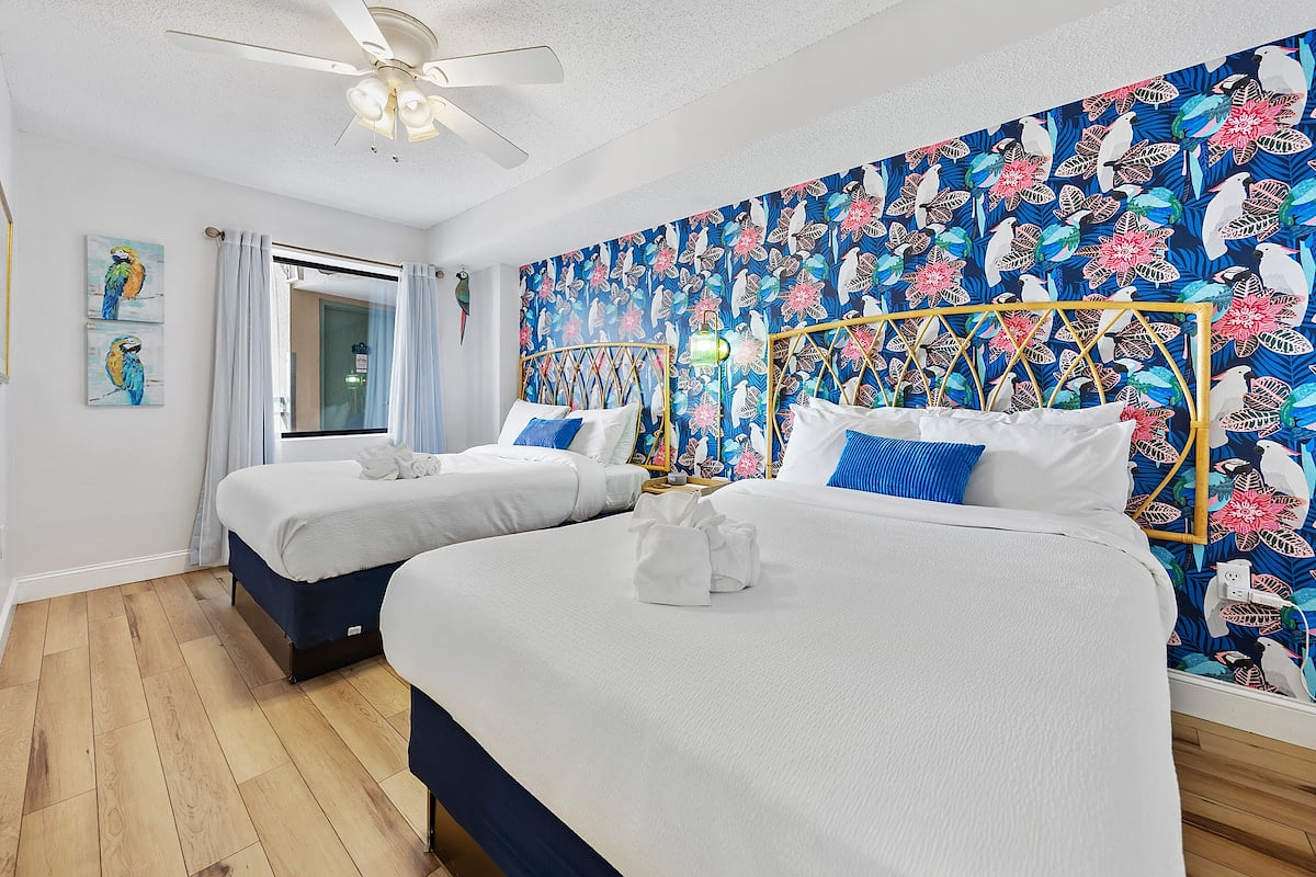 Bedroom 3 | The Parrot Room |  2 full beds | closet for storage | full size dresser | Smart TV