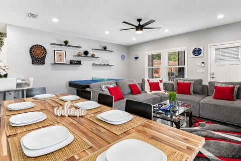 Cozy living and dining area with smart TV and ping pong table you can enjoy with family and friends. Send us an inquiry now!