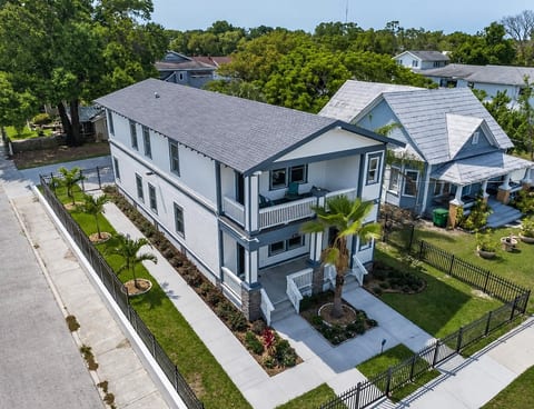 Incredible aerial front view of the house showcasing our beautiful front yard with trees and cute plants. If you are interested in this property, don't hesitate to send us an inquiry as soon as possible!