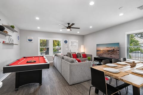 As you step into this enticing recreational area beside the living area, the pool table convertible to a ping pong table takes center stage, inviting you to embrace the thrill of gaming.