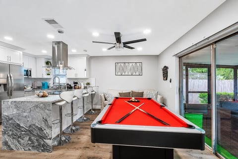 Aside from our living area, we have this amazing play area where you could enjoy playing competitive games. Our beautiful pool and ping-pong table is available for you whenever you want to play. Send us an inquiry now!