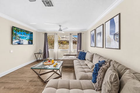 Unwind after a day of exploring in the spacious family room with plush sectional seating.
