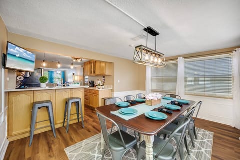 This open concept of our beautiful dining area and modern fully equipped kitchen is perfect for you and your group. Cherish this time with family and friends while on vacation.