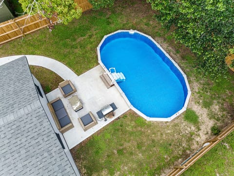 Top view of our lovely property showcasing the stunning heated pool and lounge area at the back of the property. Love what you see? Ask us questions and send us an inquiry as soon as possible!