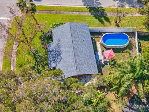 Aerial side view of our amazing property! Worry not about kids playing in the fully fenced backyard during your stay! Inquire about this property now!
