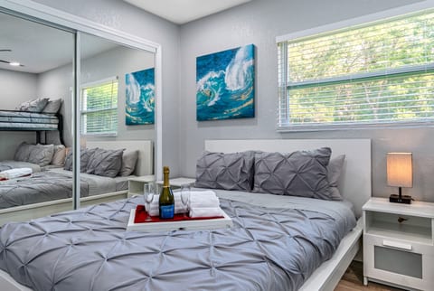 Lovely bedroom with a comfortable double sized bed and a bunk bed. This room also has its TV and a full length mirror closet. Have the best time with loved ones here! Send us a message if you have any questions regarding the property!