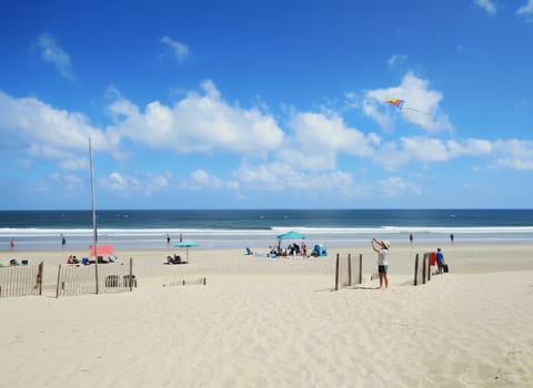 Beachside haven 137 steps from shore—waves and warm sand relax you.