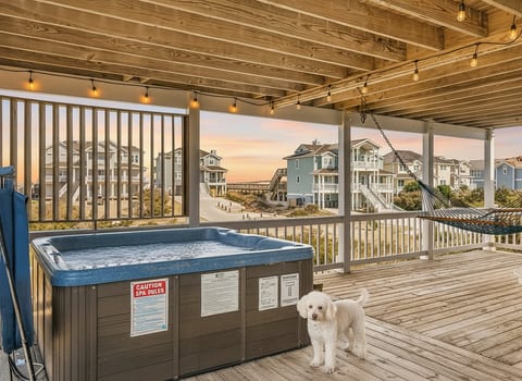 Unwind in a bubbly hot tub under twinkling lights, with salty breezes and the lull of the sea—your coastal nook of bliss!
